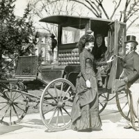 Students in costume for the centennial with Mrs. Wheaton's carriage, 1935