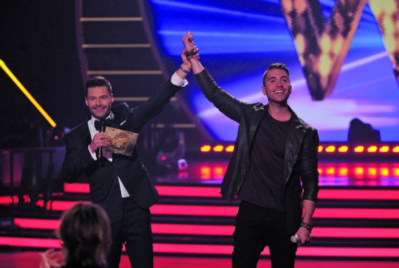 Ryan Seacrest raises Nick Fradiani’s arm, proclaiming him the winner of 