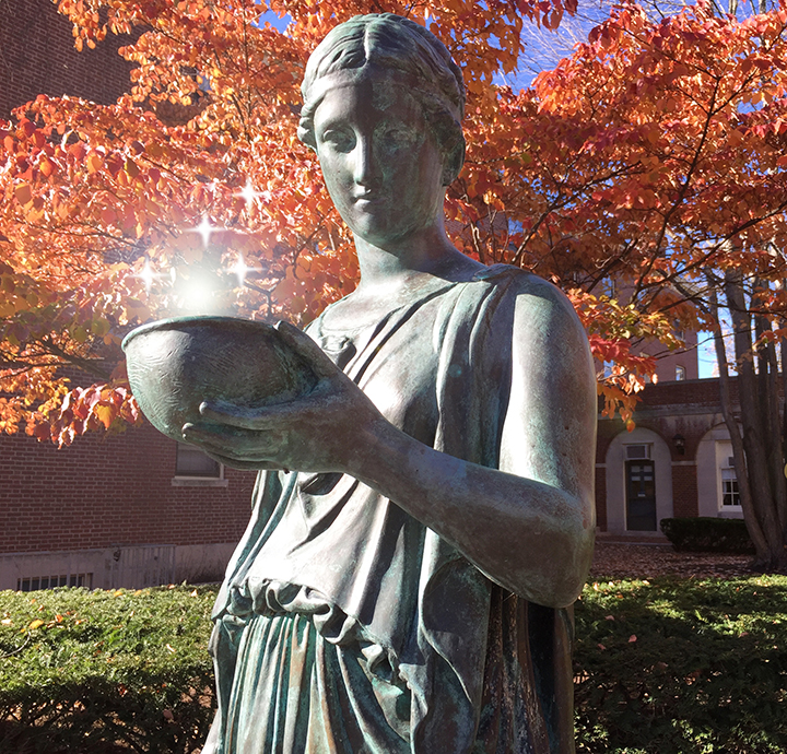 The statue and cup of Hebe glowing in the fall sunlight.