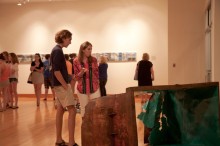Viewers taking in Kelly Goff's artwork