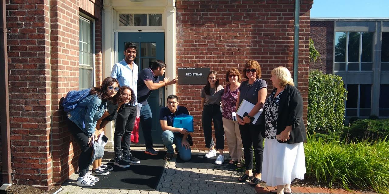 Some of our new international students posing with the Registrar's office