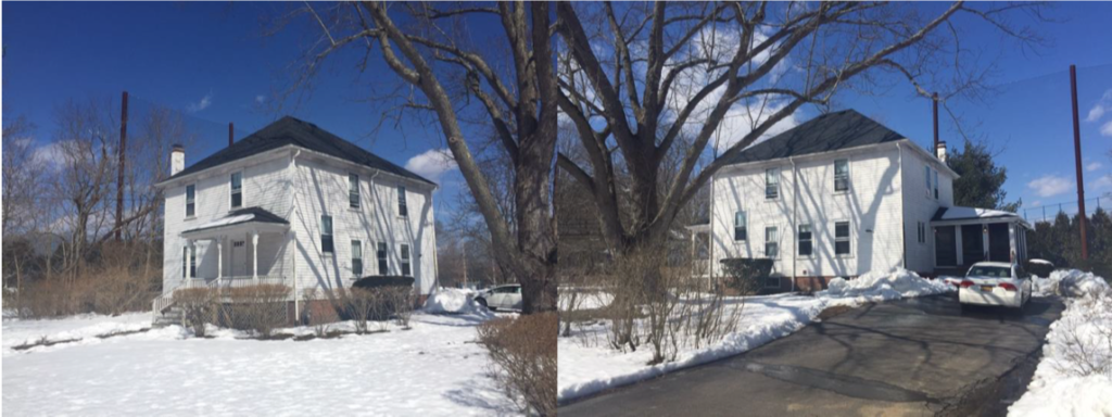 Here is a photo of a two story white house. There is snow covering the area