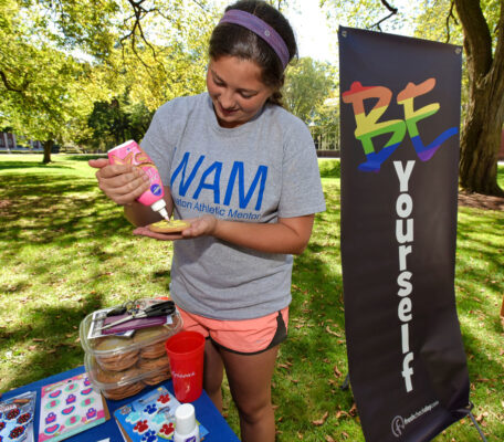 Student decorating a cookie