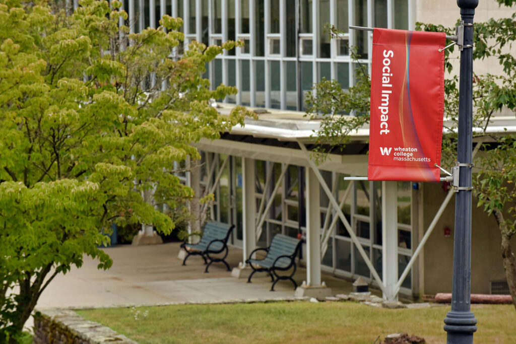 Campus photo of banner with the words social impact