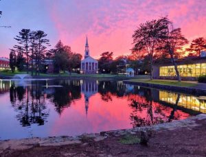 View of Chapel across Peacock Pond at sunset