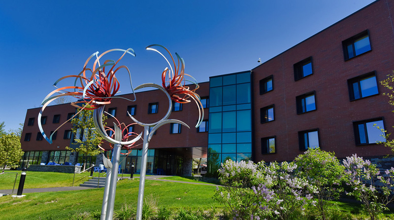 Pine Hall facade with public art sculpture in foreground