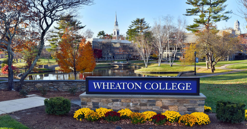Wheaton College sign near Peacock Pond