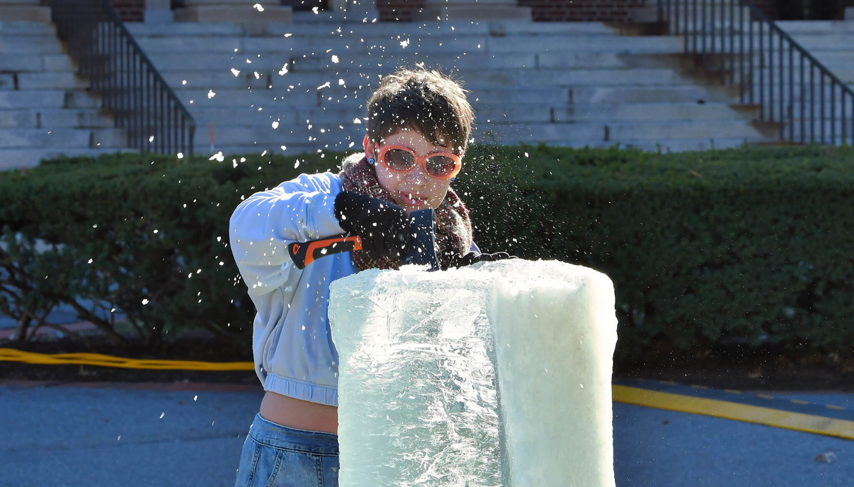Sophia Kahn works on ice sculpture