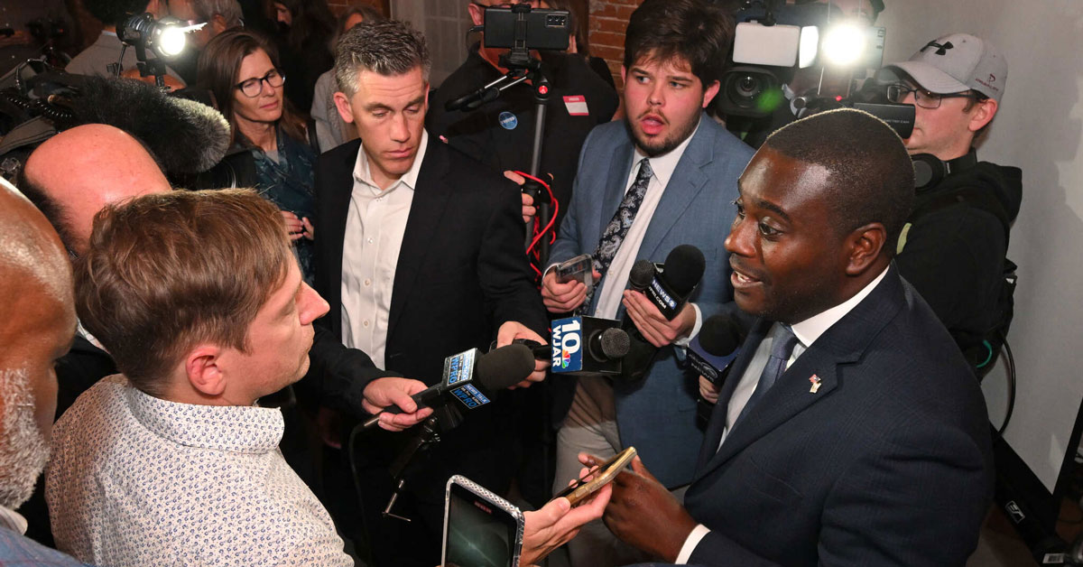 Gabe Amo being interviewed by media