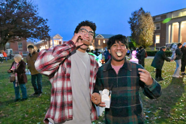 Students enjoying cider donuts at Winterfest 2023