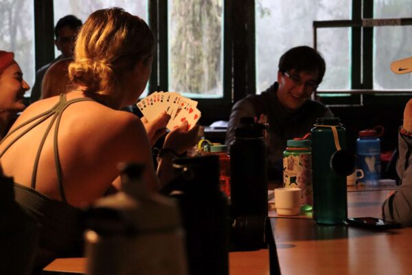 Two students playing a card game.