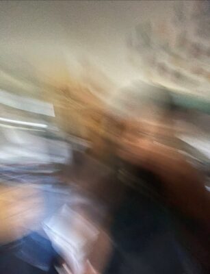 A very blurred image of a person.