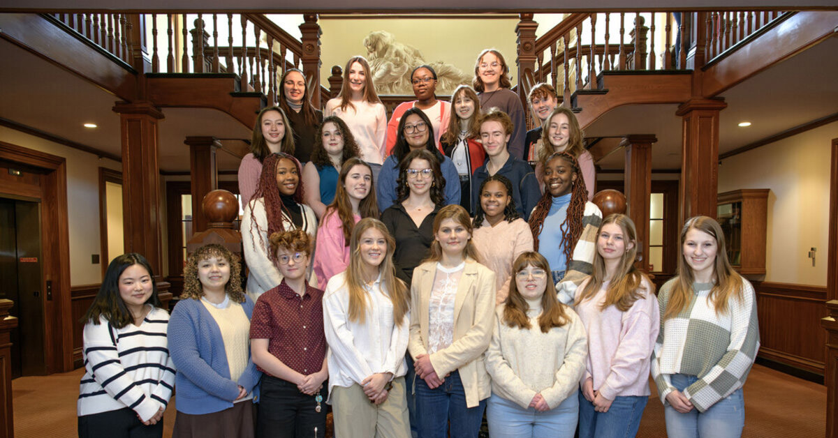 Twenty-three individuals participating in the Weiss Women's Leadership Program gather for a group photo.