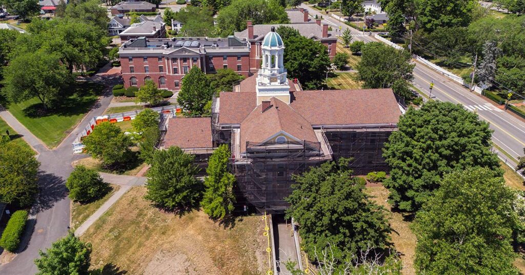 Aerial view of Mary Lyon Hall covered in scaffolding during an exterior restoration project at Wheaton College.